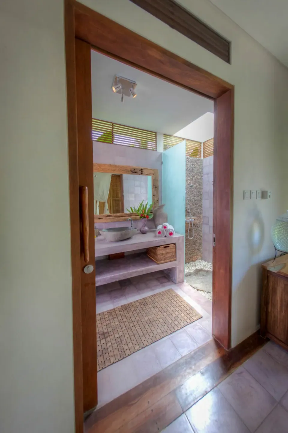 A doorway connecting the bedroom and bathroom