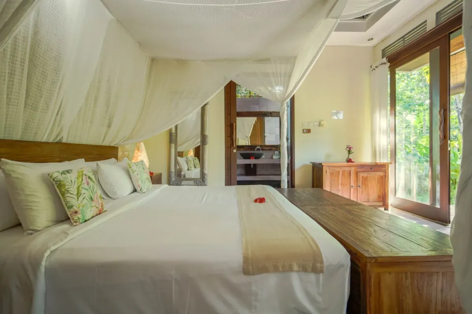A bright bedroom with timber-framed windows